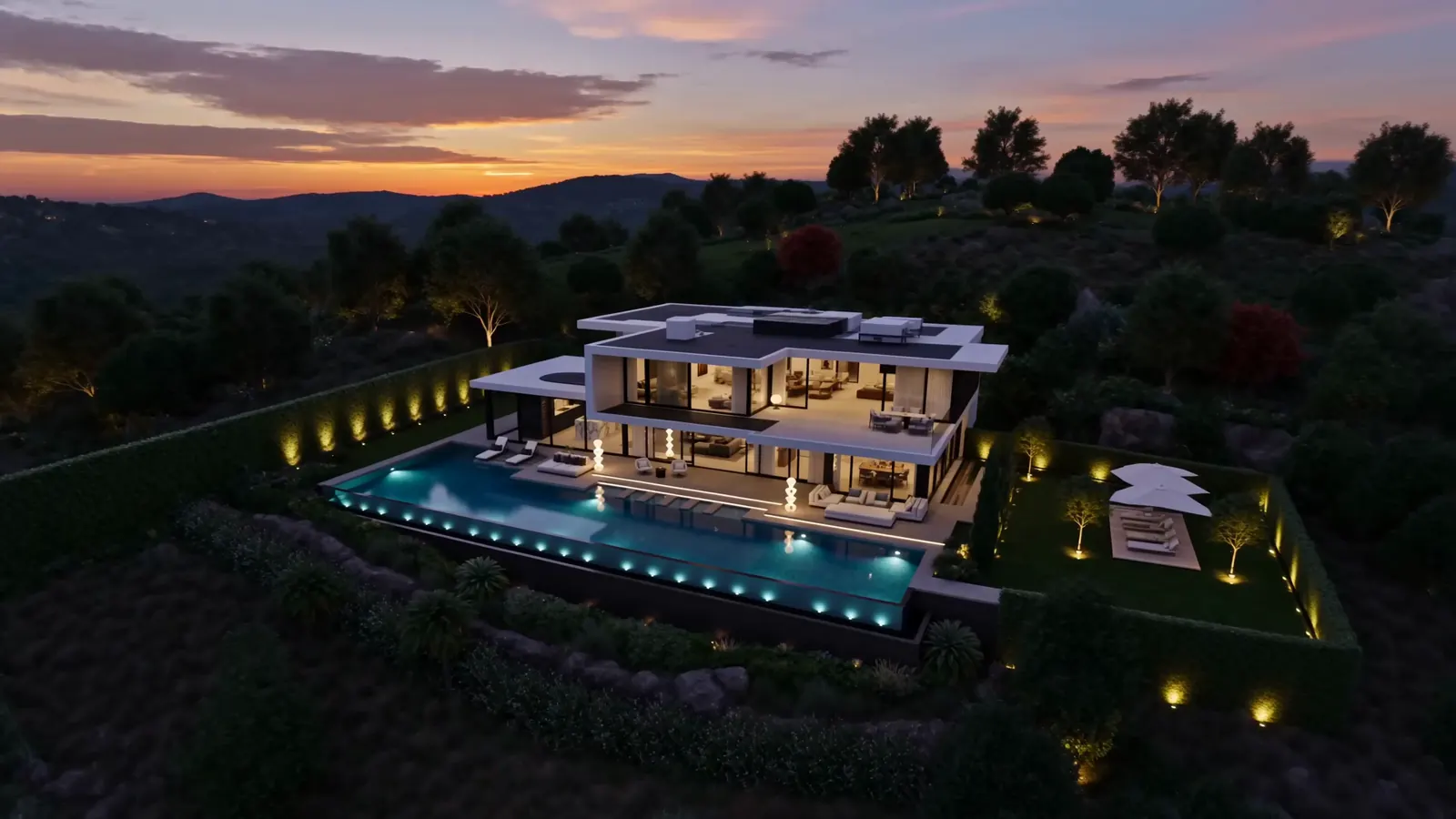 Moderne Villa mit Infinity-Pool in der Abenddämmerung, von oben